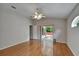 Bedroom features hardwood floor, ceiling fan and sliding glass door that leads to the patio at 6801 Bishops Pointe Way, Riverview, FL 33578