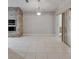Dining area features tile flooring, modern light fixture, and a brick oven in the kitchen at 6801 Bishops Pointe Way, Riverview, FL 33578