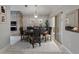 Cozy dining room with brick accent wall, built-in microwave, and sliding glass door to the lanai at 6801 Bishops Pointe Way, Riverview, FL 33578