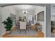 Formal dining room features hardwood floors, elegant chandelier, and space for hosting large dinner parties at 6801 Bishops Pointe Way, Riverview, FL 33578