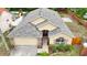 Inviting exterior of a well-maintained home with lush landscaping and brick accents at 6801 Bishops Pointe Way, Riverview, FL 33578
