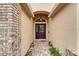 A welcoming front entrance with decorative glass door and brick accents at 6801 Bishops Pointe Way, Riverview, FL 33578