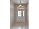 Bright foyer with a decorative glass front door and sidelight at 6801 Bishops Pointe Way, Riverview, FL 33578