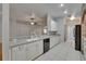 Modern kitchen featuring white cabinets, tile floors, and an open layout concept at 6801 Bishops Pointe Way, Riverview, FL 33578