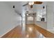 Bright and airy living room featuring wood floors and a seamless flow throughout the home at 6801 Bishops Pointe Way, Riverview, FL 33578