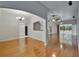 Open-concept living area with wood floors and great natural light at 6801 Bishops Pointe Way, Riverview, FL 33578