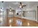 Spacious living room with hardwood floors, ceiling fans, and open layout perfect for entertaining at 6801 Bishops Pointe Way, Riverview, FL 33578