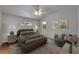 Comfortable bedroom with en suite bathroom and large, arched window at 6801 Bishops Pointe Way, Riverview, FL 33578