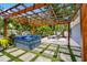 Private backyard with a hot tub, pergola, fire pit, and seating area offers an outdoor living space at 8307 Boxwood Dr, Tampa, FL 33615