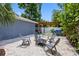 Charming backyard with a fire pit, comfortable seating, and lush greenery provides a peaceful outdoor space at 8307 Boxwood Dr, Tampa, FL 33615