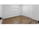 A simple bedroom with hardwood floors and a large closet offers ample storage space at 8307 Boxwood Dr, Tampa, FL 33615