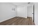 This bedroom features hardwood floors, a window, and a closet at 8307 Boxwood Dr, Tampa, FL 33615