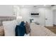 This bedroom features an electric fireplace, white walls, and lots of natural light at 8307 Boxwood Dr, Tampa, FL 33615