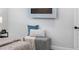 This is a bedroom with white walls, a fireplace, and a small bench at 8307 Boxwood Dr, Tampa, FL 33615