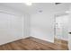A bright bedroom with hardwood floors and a double closet door at 8307 Boxwood Dr, Tampa, FL 33615