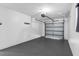 Clean, spacious garage with painted floor and white walls at 8307 Boxwood Dr, Tampa, FL 33615