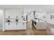 Large open concept kitchen with white cabinets, stainless appliances, and island at 8307 Boxwood Dr, Tampa, FL 33615