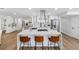 Spacious kitchen with a large island, sleek white cabinetry, and modern appliances at 8307 Boxwood Dr, Tampa, FL 33615