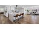 Bright open kitchen boasts quartz island with seating and stainless steel appliances at 8307 Boxwood Dr, Tampa, FL 33615