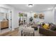 Cozy living room with sliding glass doors and an adjacent bathroom at 8307 Boxwood Dr, Tampa, FL 33615