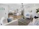 Bright and airy living room with modern furnishings, open to the kitchen at 8307 Boxwood Dr, Tampa, FL 33615