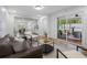 Inviting living room with modern furniture and sliding door access to outdoor patio at 8307 Boxwood Dr, Tampa, FL 33615