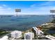Gorgeous aerial view of waterfront condos with views of Clearwater Beach and the BayCare Sound in the distance at 100 Oakmont Ln # 305, Belleair, FL 33756