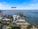 Beautiful aerial view of waterfront condos with stunning views of Belleair Beach in the distance at 100 Oakmont Ln # 305, Belleair, FL 33756