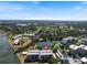 Scenic aerial view of condo building with water view, and community amenities, Sarasota, Florida at 100 Oakmont Ln # 305, Belleair, FL 33756