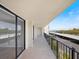 Relaxing balcony space features a seating area, and beautiful views of the surrounding area at 100 Oakmont Ln # 305, Belleair, FL 33756