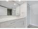 Bathroom features a modern vanity with quartz countertops and sleek white cabinetry at 100 Oakmont Ln # 305, Belleair, FL 33756