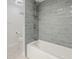 Bright bathroom with a modern tub, stylish tile, and updated fixtures for a luxurious feel at 100 Oakmont Ln # 305, Belleair, FL 33756