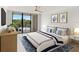 Bright bedroom featuring a bed with blue and white bedding and private balcony overlooking the lake at 100 Oakmont Ln # 305, Belleair, FL 33756