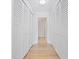 Hallway with custom, built-in closets perfect for maximum storage and organization at 100 Oakmont Ln # 305, Belleair, FL 33756