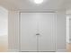 Clean, bright double door closet in condo entryway at 100 Oakmont Ln # 305, Belleair, FL 33756