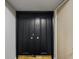 Stylish condo front door with unique star accent hardware at 100 Oakmont Ln # 305, Belleair, FL 33756