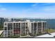Waterfront condo exterior view with balcony, and gorgeous bay views in Sarasota, Florida at 100 Oakmont Ln # 305, Belleair, FL 33756