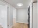 Hallway with recessed lighting leads to a washer and dryer, and other rooms at 100 Oakmont Ln # 305, Belleair, FL 33756