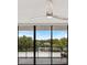 Screened lanai with a beautiful view of the surrounding trees and waterfront at 100 Oakmont Ln # 305, Belleair, FL 33756