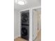Efficient stacked washer and dryer unit conveniently located in a hallway closet at 100 Oakmont Ln # 305, Belleair, FL 33756