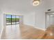 Spacious, bright, living room with wood floors and a view of the water at 100 Oakmont Ln # 305, Belleair, FL 33756