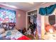View of pink bedroom and closet at 10854 Telford St, New Port Richey, FL 34654