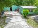 Driveway leading up to a single-story home, focusing on its outdoor access and potential at 10854 Telford St, New Port Richey, FL 34654