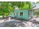 Side view single story house, highlighting its connection to the outdoor spaces at 10854 Telford St, New Port Richey, FL 34654