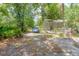 Driveway leading up to screened pool, emphasizing its location and potential at 10854 Telford St, New Port Richey, FL 34654