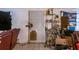 Showing tile floor and door needing repair at 10854 Telford St, New Port Richey, FL 34654