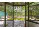 Indoor pool with screens, highlighting the potential and maintenance needs at 10854 Telford St, New Port Richey, FL 34654