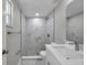 Updated bathroom featuring shower with modern tile, fixtures and bright lighting at 10900 Queens Rd, Port Richey, FL 34668