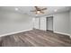 Comfortable bedroom featuring updated flooring, closet and ensuite access at 10900 Queens Rd, Port Richey, FL 34668