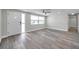 The living room boasts new floors, fresh paint, and a bright, airy feel, enhanced by the natural light at 10900 Queens Rd, Port Richey, FL 34668
